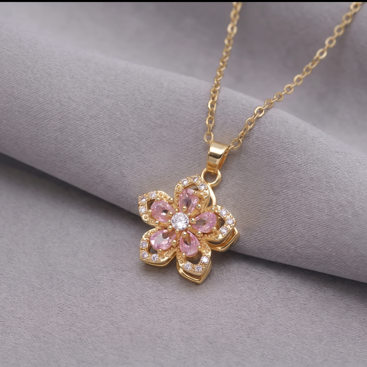 FLOWER SPINNER WELLNESS NECKLACE GOLD PINK