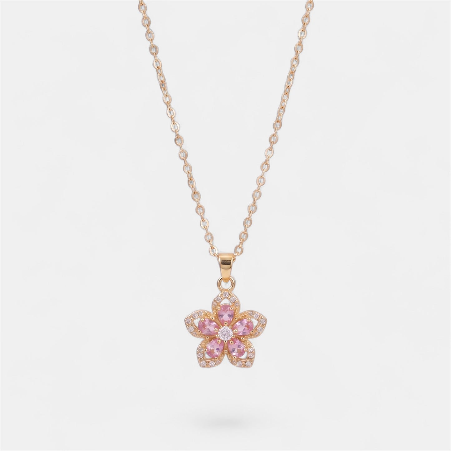 FLOWER SPINNER WELLNESS NECKLACE GOLD PINK