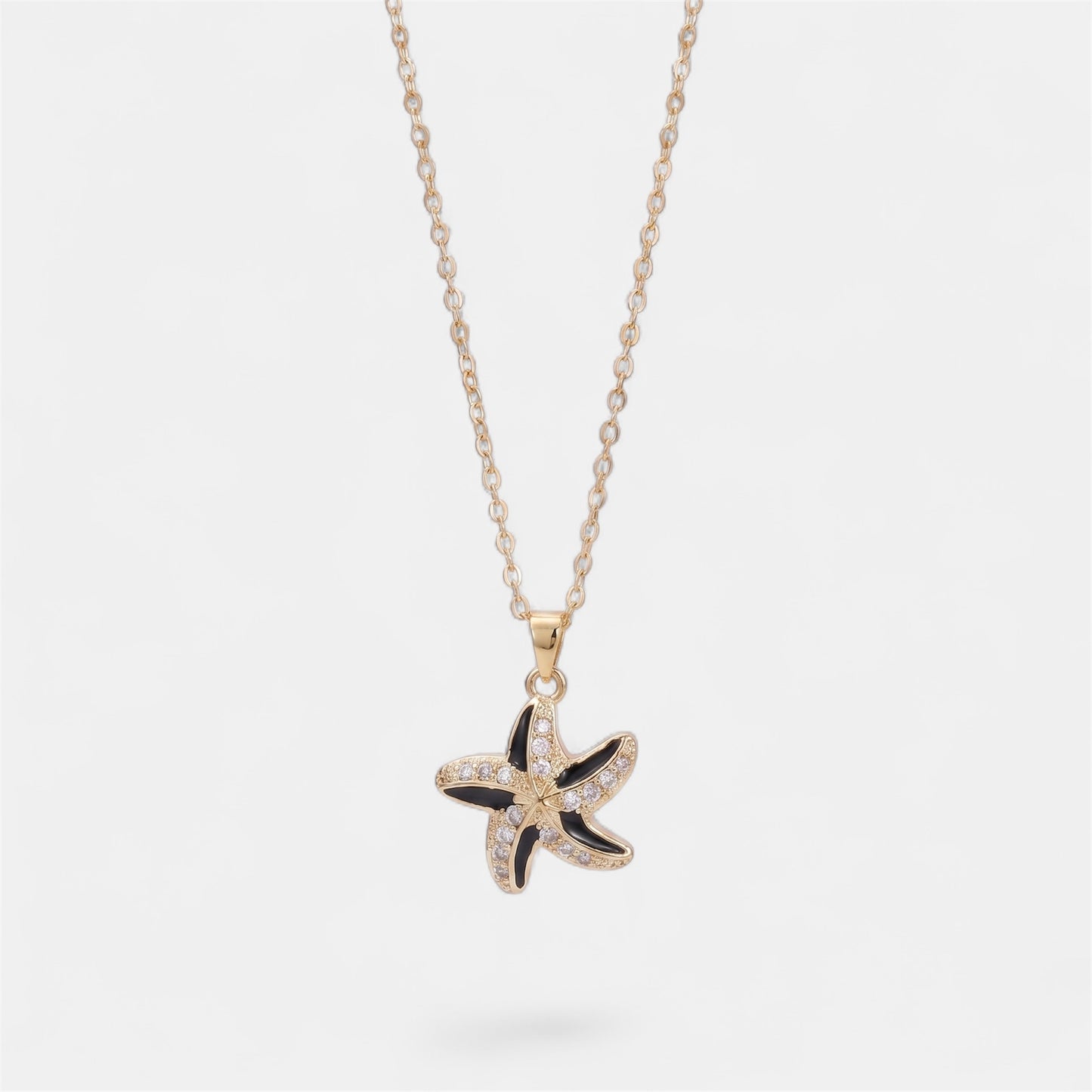 STAR SPINNER WELLNESS NECKLACE GOLD BLACK