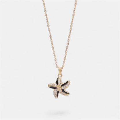 STAR SPINNER WELLNESS NECKLACE GOLD BLACK