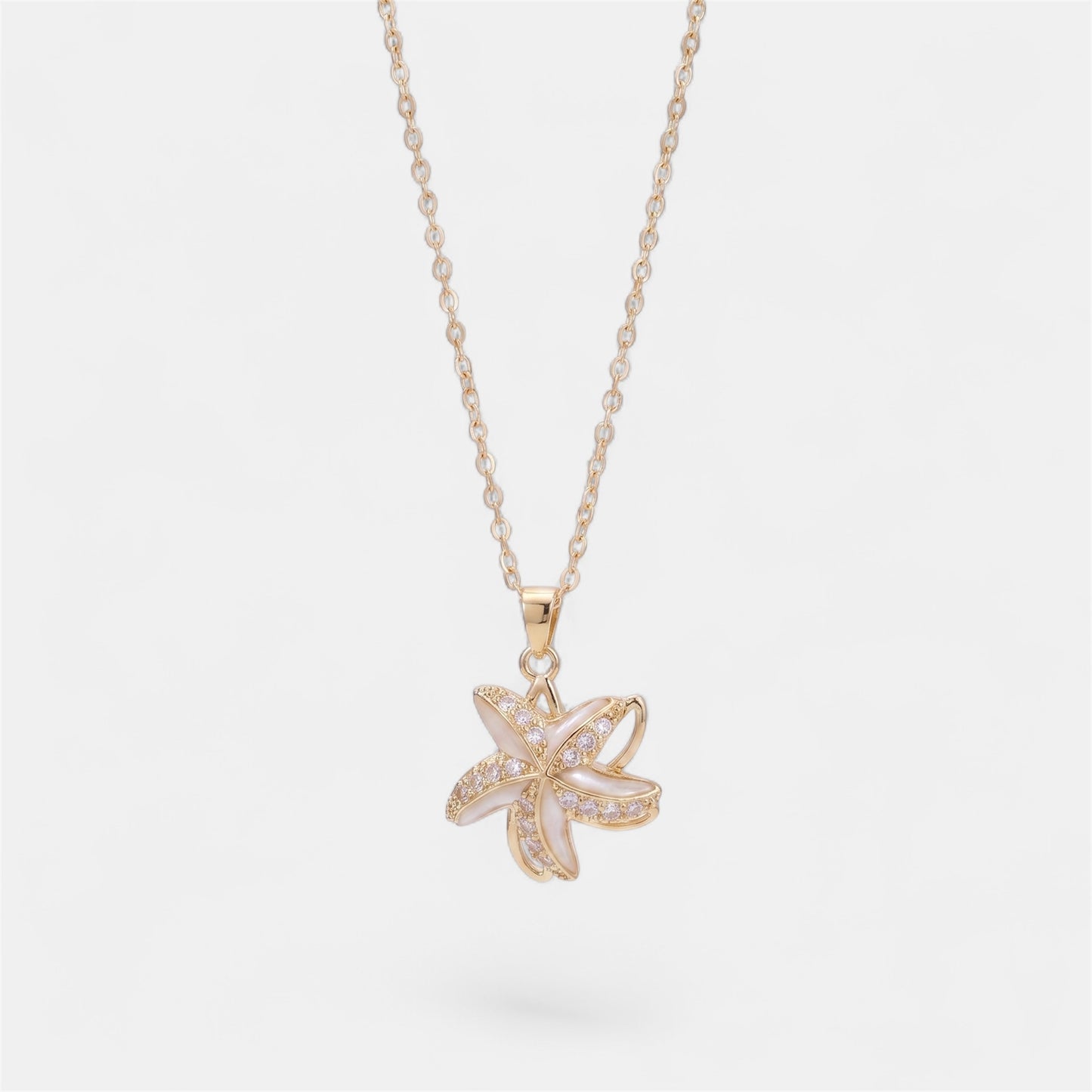 STAR SPINNER WELLNESS NECKLACE GOLD WHITE